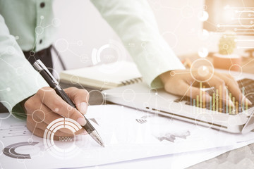 business man working about business investment report on desk office.