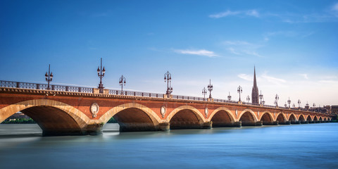 Wall Mural - panorama of pont de pierre bridge with st michel cathedral in bordeaux, france