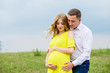 © demchyna - Portrait beautiful young couple waiting for baby. Photo shoot at nature