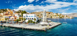 Fototapeta  - Panorama of beautiful summers day on the Greek island  Symi in the Dodecanese Greece Europe