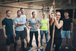 © Flamingo Images - Woman holding climbing rope in cross-fit exercises