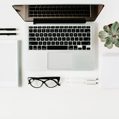 Flat lay, top view office table desk. Workspace with laptop, diary, succulent and glasses on white background.