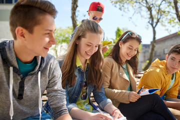 Poster - group of students with notebooks at school yard