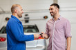 © Syda Productions - auto mechanic giving key to man at car shop