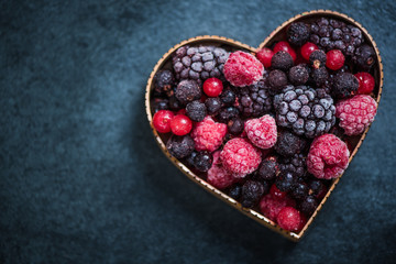 Frozen berries in heart symbol