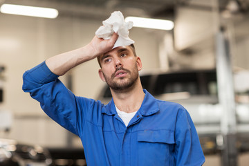 Poster - tired auto mechanic man or smith at car workshop