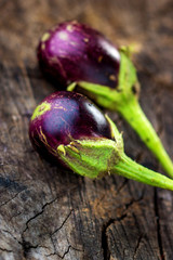 Wall Mural - Fresh eggplant on wooden background