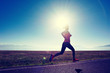 © lzf - healthy lifestyle young fitness woman runner running on road