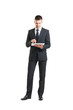 © Acronym - Young and confident business man holding a tablet