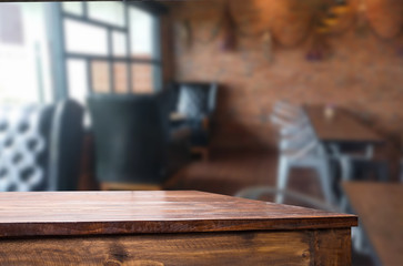 Wall Mural - Selected focus empty brown wooden table and Coffee shop blur bac