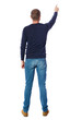 © ghoststone - Back view of  pointing young men in  shirt and jeans. Young guy  gesture. Rear view people collection.  backside view of person.  Isolated over white background. The guy in the black sweater is