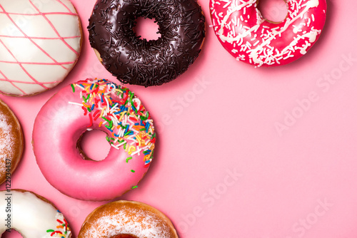 Donuts with icing on pastel pink background. Sweet donuts. Tableau sur Toile
