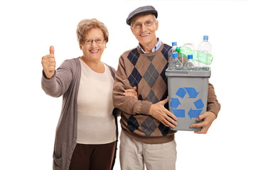 Wall Mural - Man holding recycling bin and woman giving thumb up