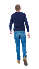 Poster - Back view of going  handsome man. walking young guy . Rear view people collection.  backside view of person.  Isolated over white background. Man in warm jacket goes away.