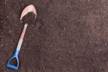 Little Shovel Partially Covered In Soil
