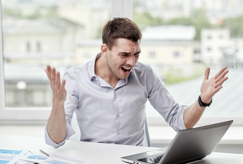 Sticker - angry businessman with laptop and papers in office