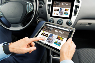 Wall Mural - close up of man with tablet pc in car