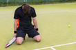 © kolotype - Young male player fell on his knees because of the loss in tenni