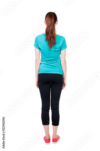 Download back view of standing young beautiful woman. girl watching ...