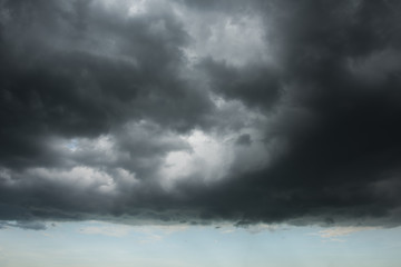 Wall Mural - Dark storm cloud layer with blue sky