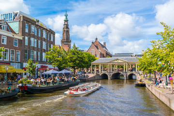 New Rhine canal, town hall tower and Koornbrug bridge, Leiden, Netherlands