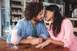 © WavebreakMediaMicro - Couple romancing in cafeteria