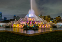 Chicago Skyline Panorama With Skyscrapers And Buckingham Fountain In Grant Park At Night Lit By Colorful Lights.