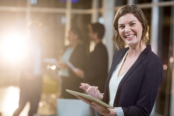 Poster - Businesswoman using digital tablet