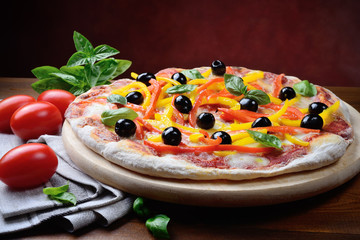 Wall Mural - Pizza with tomato, mozzarella, peppers, olives, extra virgin and basil