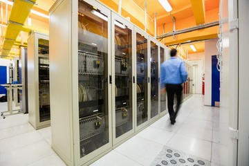 Poster - Technician walking in server room