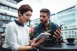 © WavebreakmediaMicro - Businesspeople discussion on digital tablet while having coffee