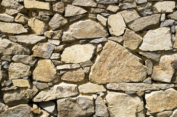 Old colorful stone wall closeup