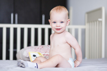 Smiling little boy in children bad