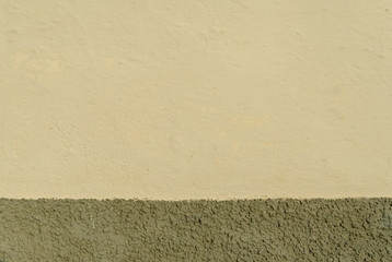 texture of a wall with two colors, target and gray, in Salorino, Caceres, in Extremadura, Spain