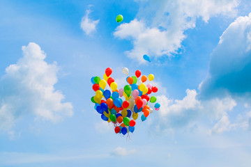 colourful, heart shaped balloons flying in the sky,