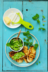 Wall Mural - Snack of peas and mint with toast.