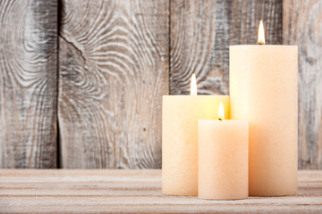 Canvas Print - Candles on wooden background