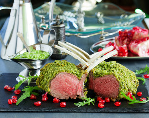 Canvas Print - Rack of lamb in herb cheese and breadcrumbs. A festive meal. Selective focus.