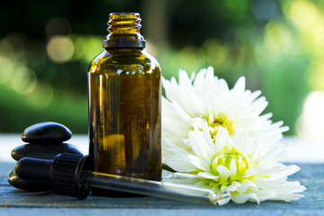 spa concept with body oils and stones.