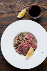 Poster - Top view of roasted tuna steak served with buckwheat noodles