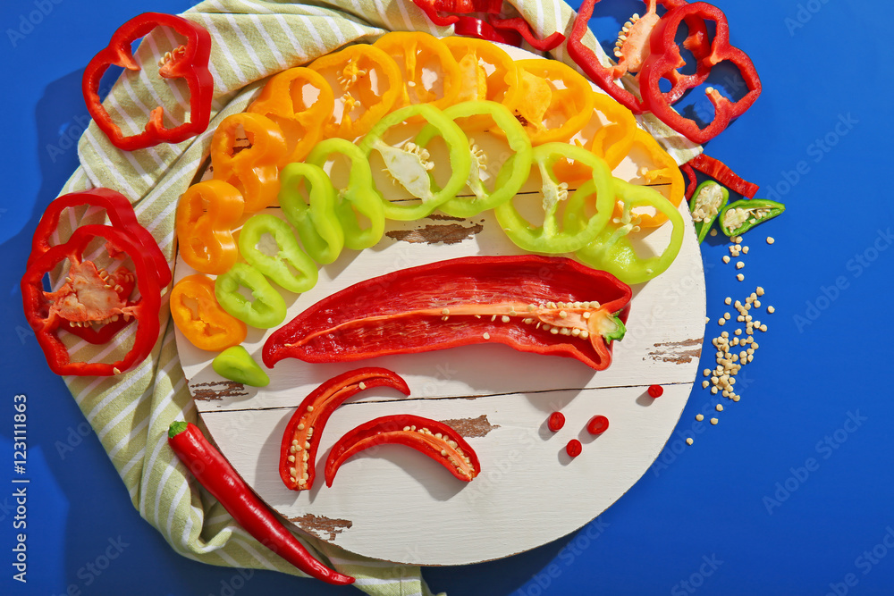 Fresh peppers on blue background