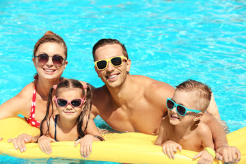 Poster - Happy family in swimming pool at water park