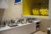 Bowls With Macaroni Stand On The Yellow Shelve