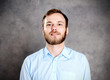 © Firma V - young bearded man in blue shir