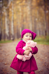 Wall Mural - Little girl in autumn park