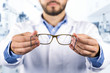 © ronstik - eyesight care concept - optician giving new optical glasses