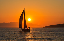 Sailing Boat On The Sea At Sunset.