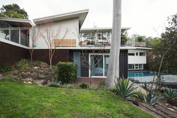 Exterior of a large mid century modern Australian home with pool