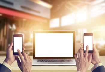 Wall Mural - Businessman with smartphone in hands and laptop computer blank space