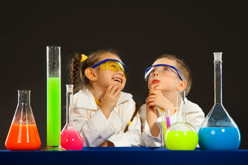 little boy and girl doing experiments in the laboratory